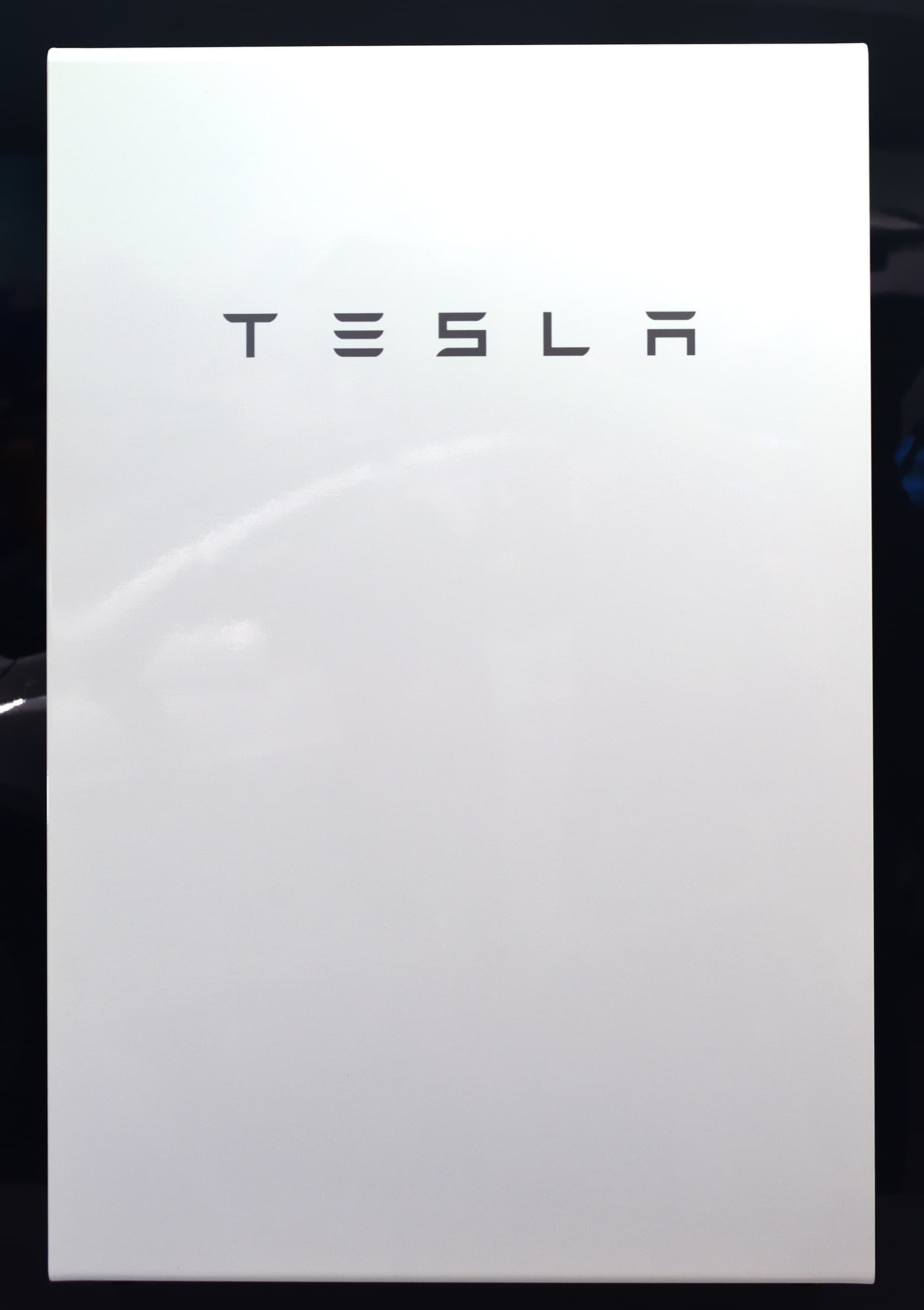 Tesla Powerwall 2 home battery mounted on a residential wall