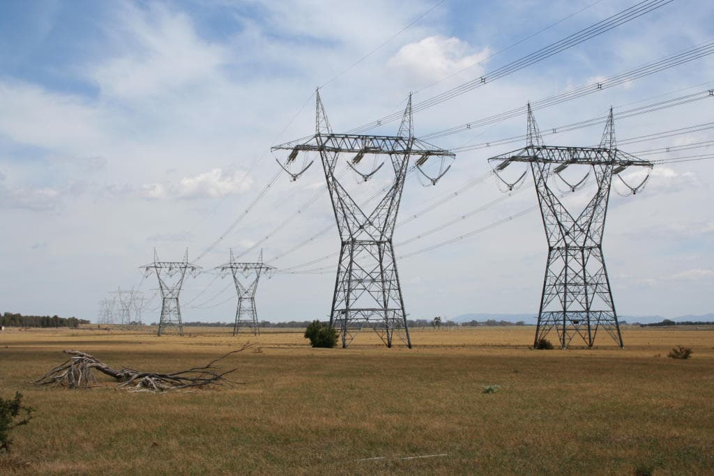 High-voltage transmission lines running across paddocks on Melbourne's northern fringe
